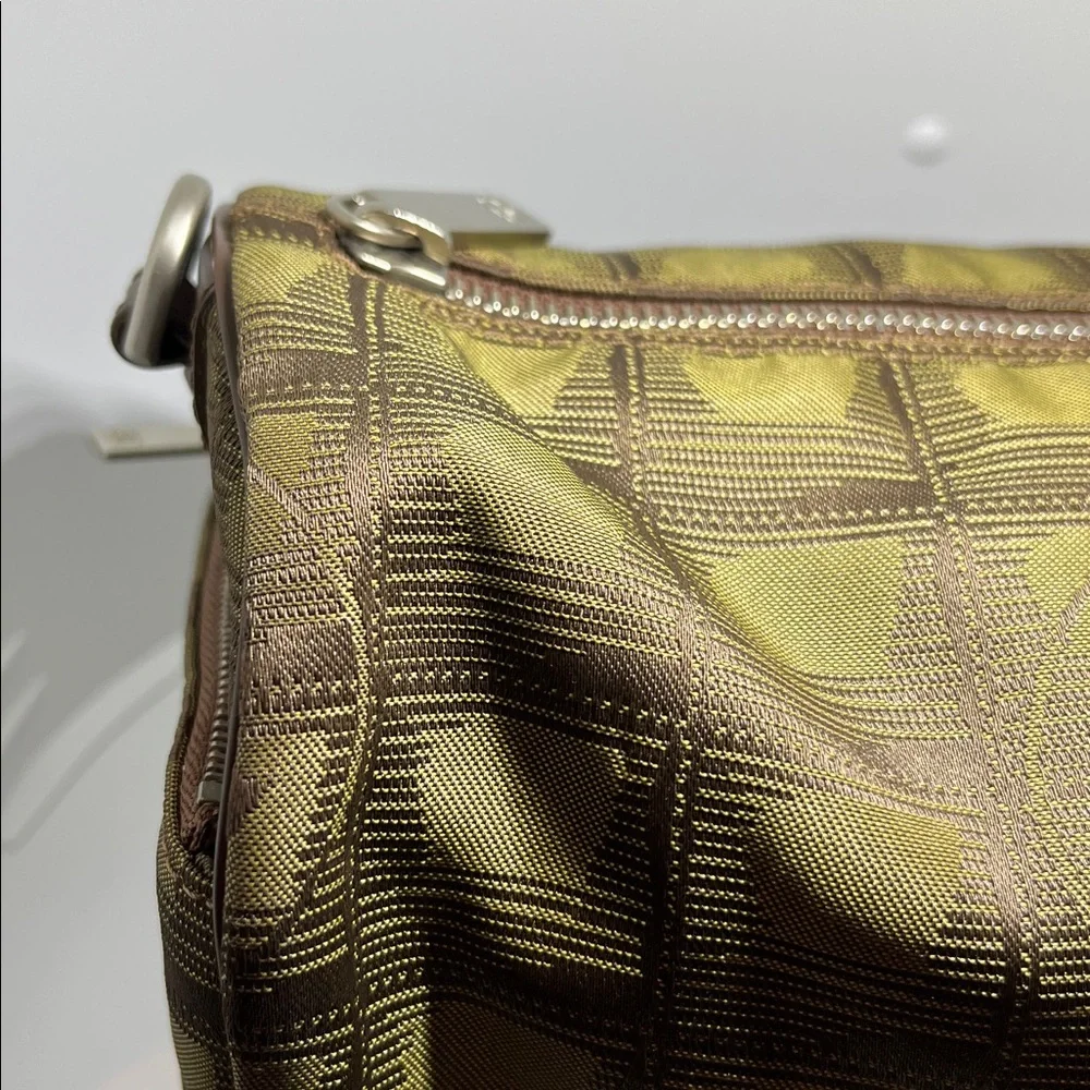 Chanel New Travel Line Mini Roll or Barrel Bag in a khaki or olive green color
